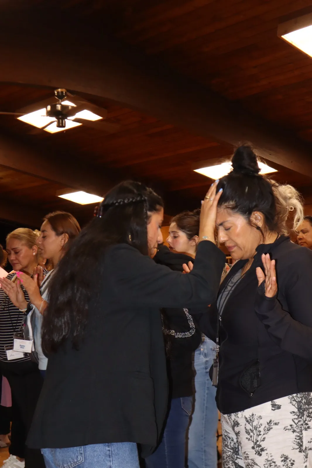 Praying for people at a revival gathering